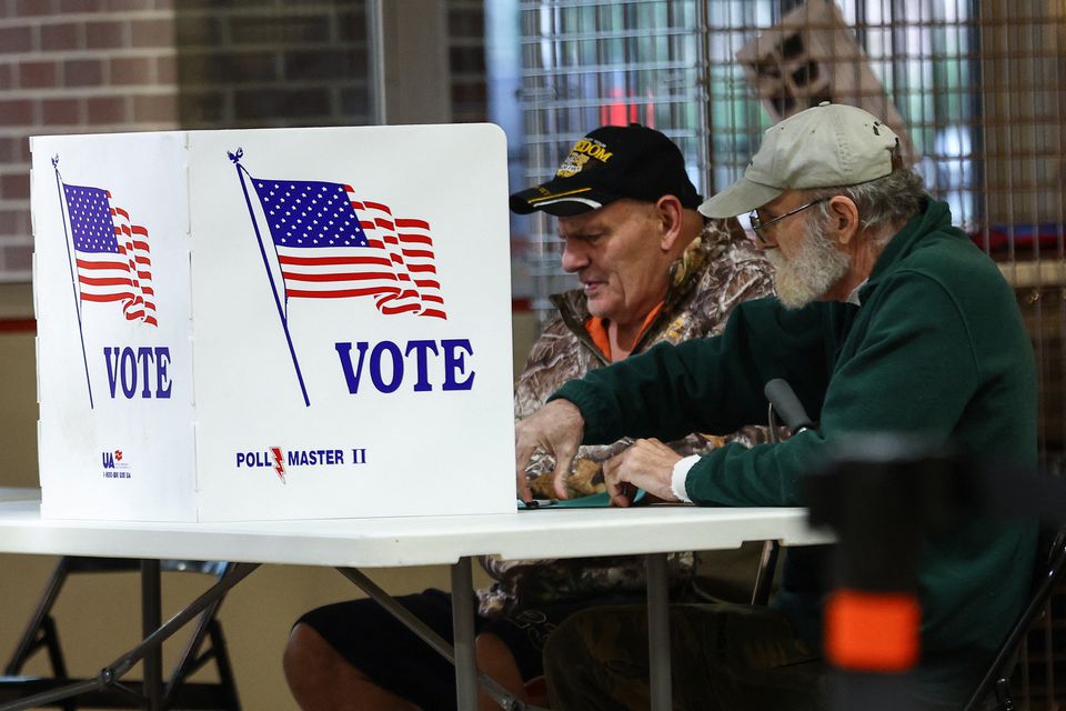 oters fill out ballots at a polling station during the 2022 U.S. midterm election in downtown Harrisburg, Pennsylvania, U.S., November 8, 2022. REUTERS/Mike Segar